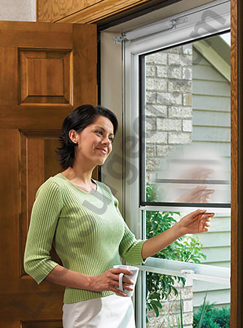 Airdrie Larson screen door showing in use in residential home.